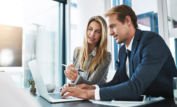 man woman and partnership with research laptop and typing with help explain and coaching in workplace