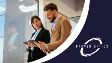 a man and woman looking at a tablet