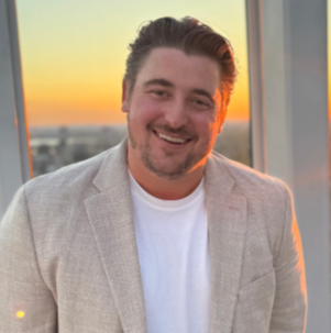 a man smiling at the camera