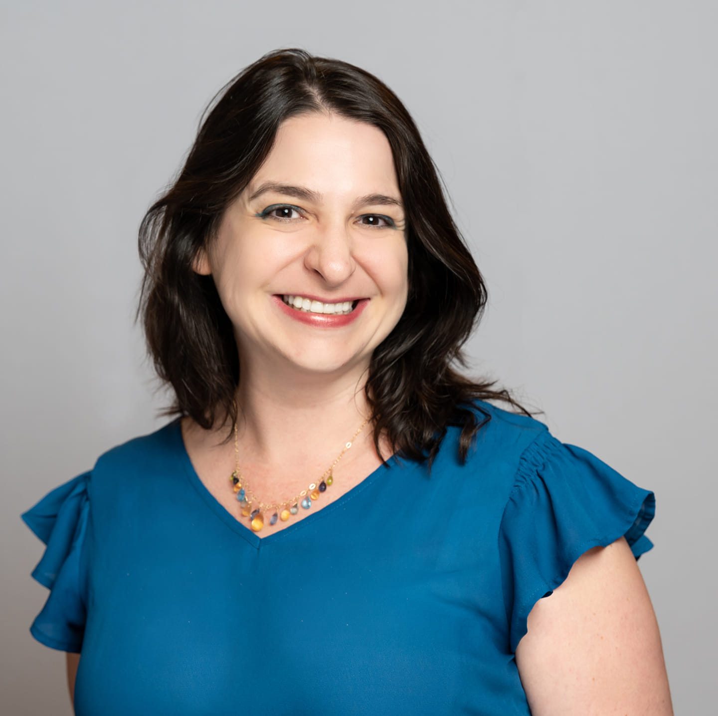 a woman in a blue shirt